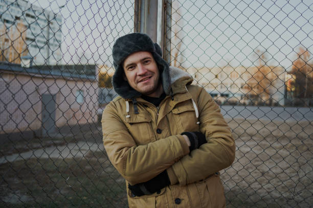 istock Happy handsome young man in cap with earflaps. 1125689233
