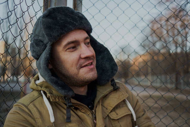 istock Happy handsome young man in cap with earflaps. 1125689269