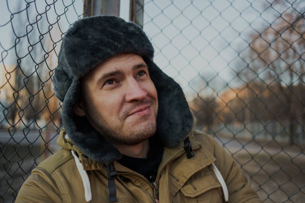 istock Happy handsome young man in cap with earflaps. 1125689271