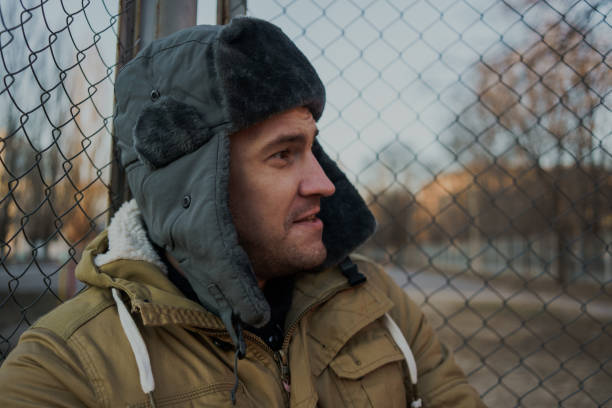 istock Happy handsome young man in cap with earflaps. 1125689279