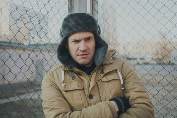 istock Happy handsome young man in cap with earflaps. 1125689333