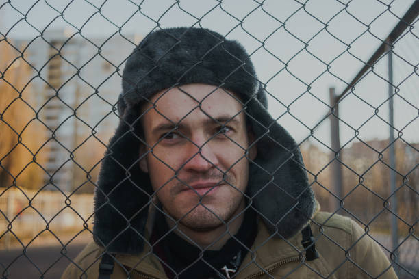 istock Happy handsome young man in cap with earflaps. 1125689770