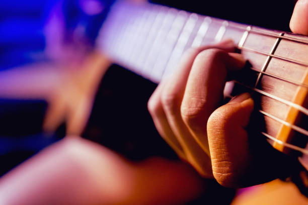 istock Girl playing guitar.Grain film. 1125690189