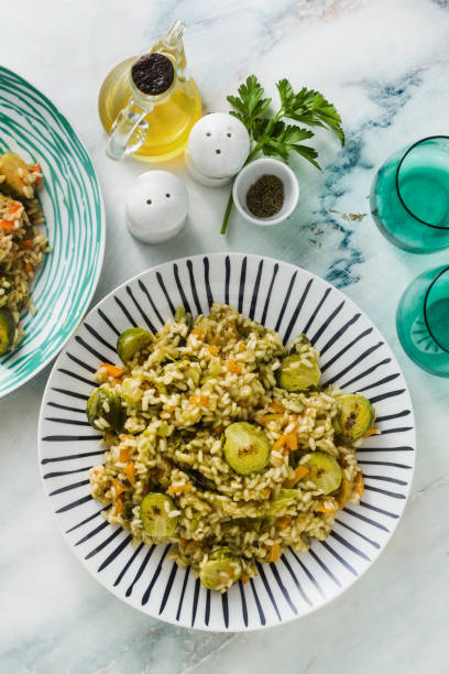 istock spring risotto on a marble table with spices and olive oil 1125690425