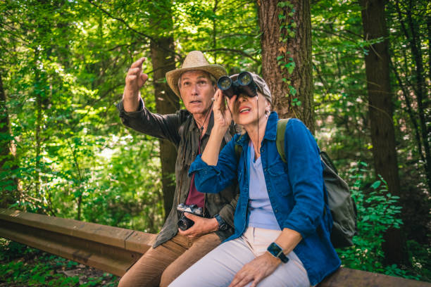 istock seniors taking a break from hiking 1125690910