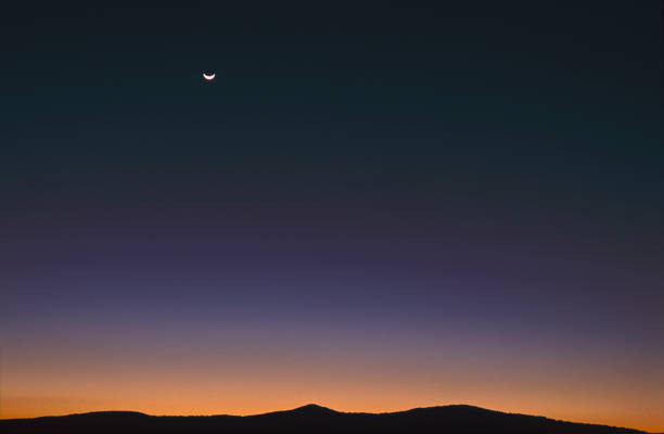 istock mountains Sunrise with moon in the sky 1125691837