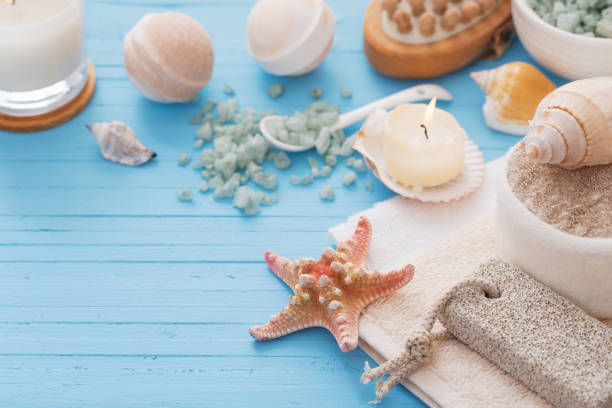 istock Spa concept with candles on blue wooden background 1125692109