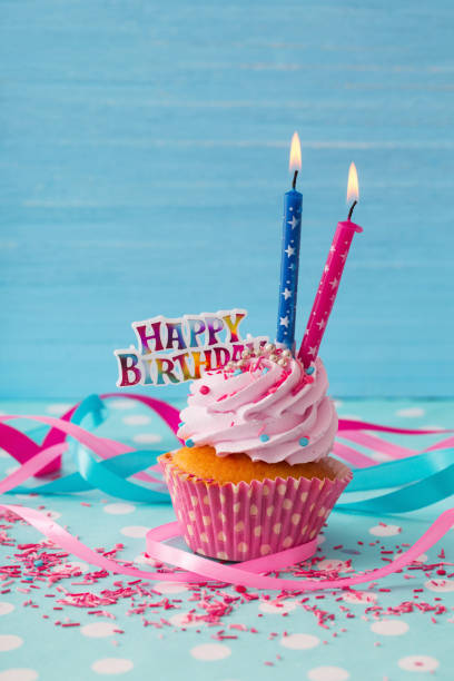 istock birthday cake on blue wooden background 1125692136