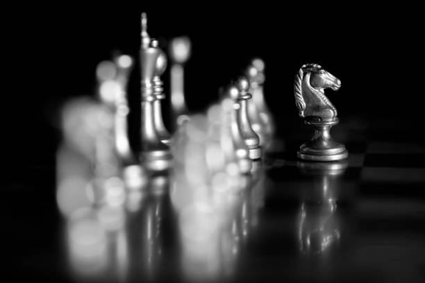 istock Pieces on chess board for playing game and strategy knight kingdom gaming 1125692387