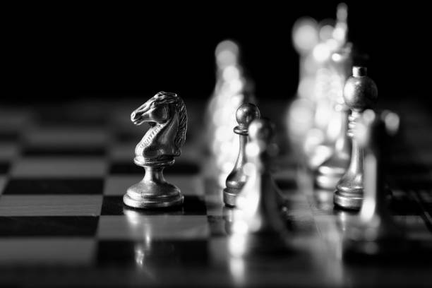 istock Pieces on chess board for playing game and strategy knight kingdom gaming 1125692392