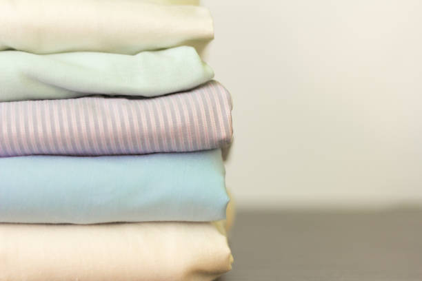 istock stack of folded clothes on the table, clean linen 1125692414