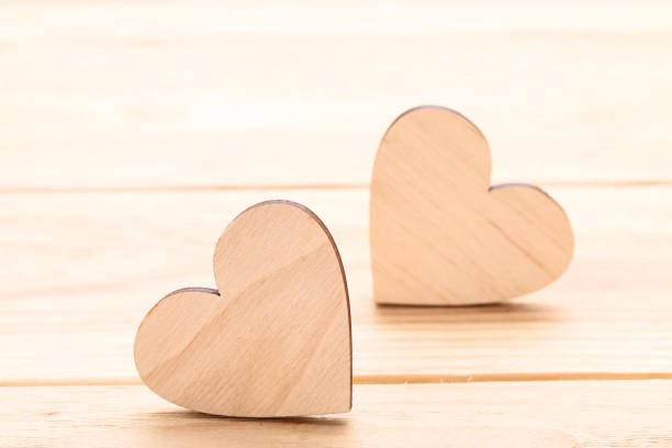 istock Brown hearts on wooden table 1125692900