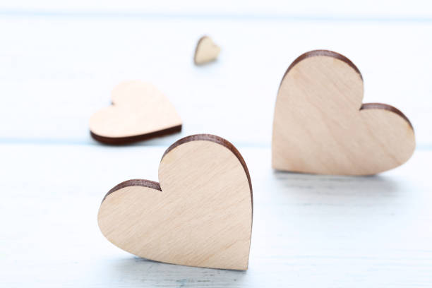 istock Brown hearts on wooden table 1125693920