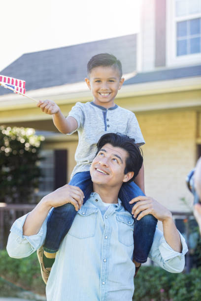 istock Patriotic man and son 1125694518