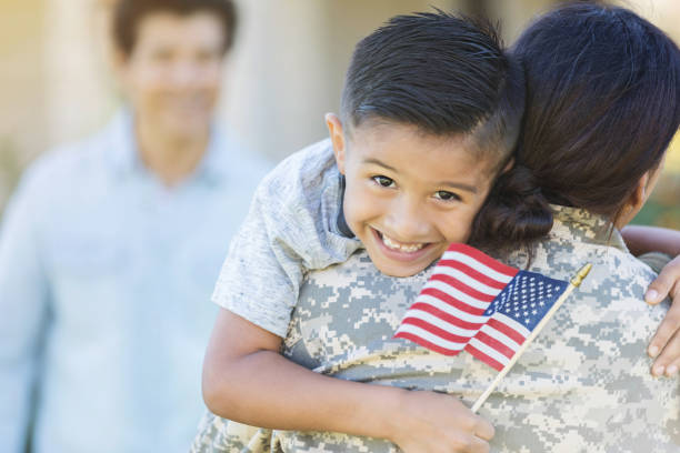 istock Excited boy hugging military mom 1125694531