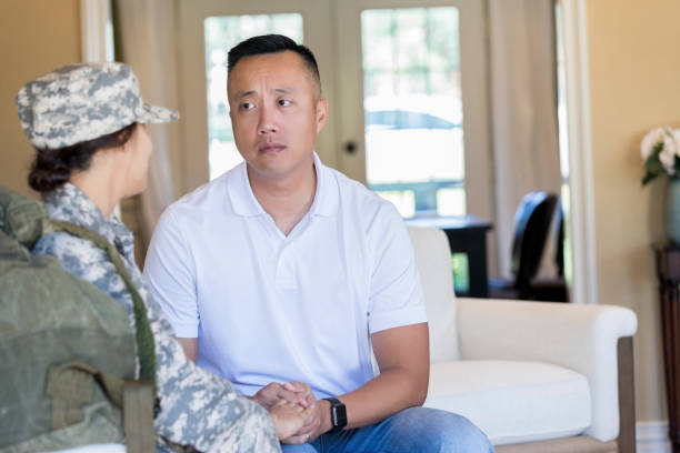 istock Serious man talks with army wife 1125694561