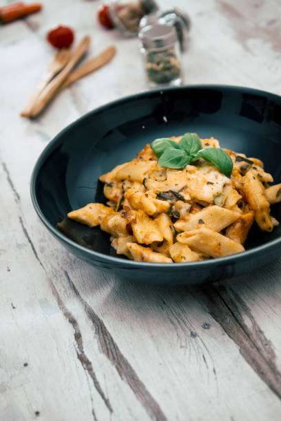 istock Penne gratin with vegetables, grilled zucchini and marinated tomatoes 1125694811