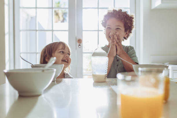 istock Smiling kids at the breakfast table 1125695385