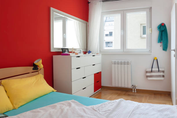 istock Cozy modern colorful bedroom interior with bed sheet 1125695880