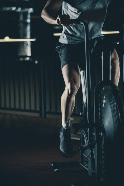 istock Man doing air bike high-intensity interval workout 1125700332