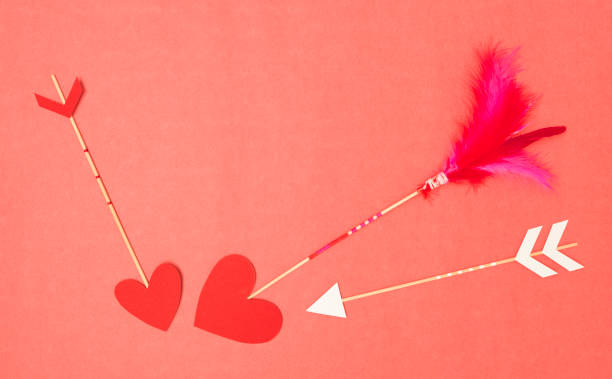 istock beautiful red valentine background with love arrows and hearts 1125700514