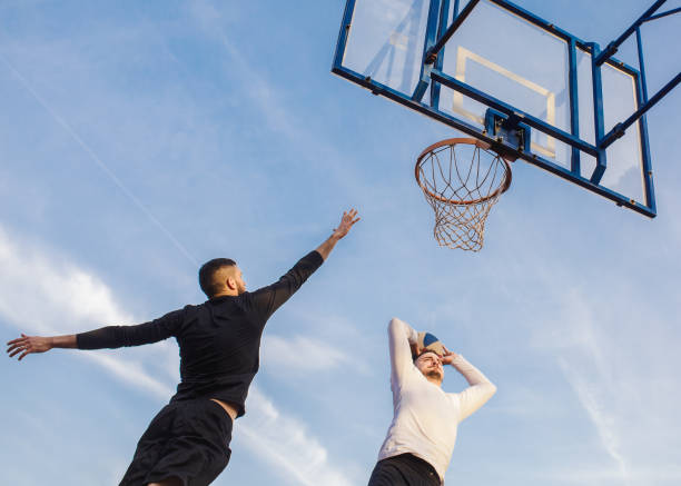 istock Friends playing basketball 1125700961