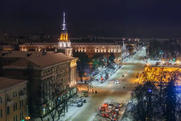 Night Voronezh downtown in winter, aerial summer cityscape from rooftop.