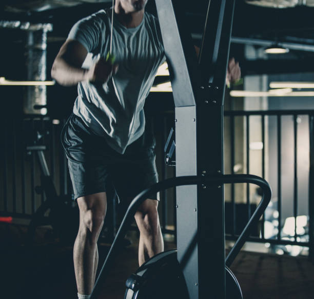 istock Man pulling resistance bands in the gym 1125704011
