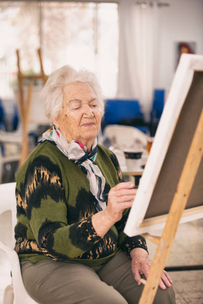 istock Older woman studying art. 1125705841