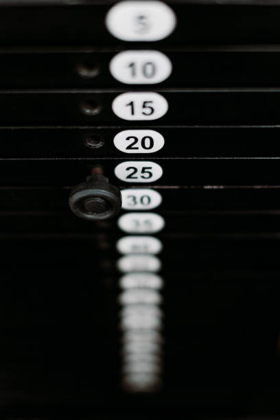 Close-up of the weights on a barbell machine