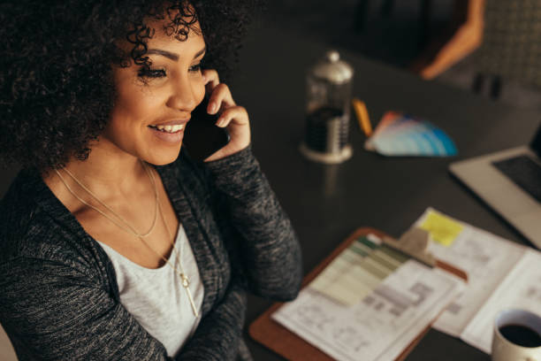 istock Female architect talking with client over phone 1125706319