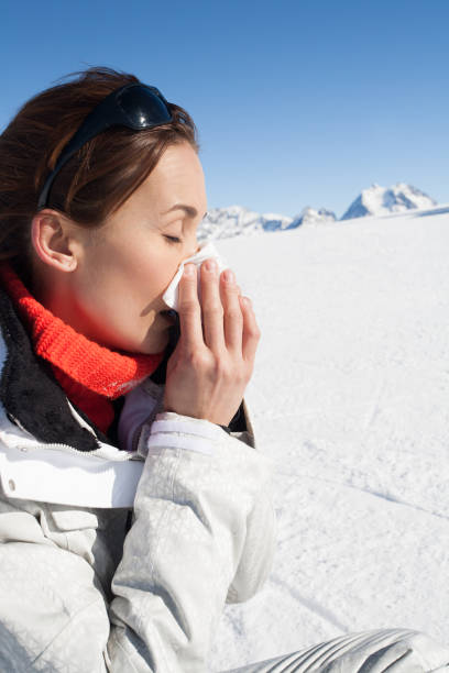 istock woman sniffing in the snow 1125706735