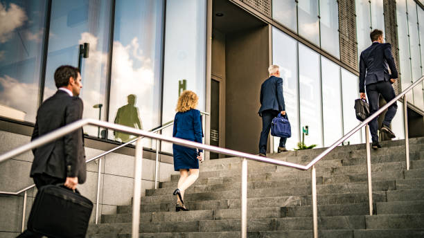 istock Business people walking on stairs 1125707293
