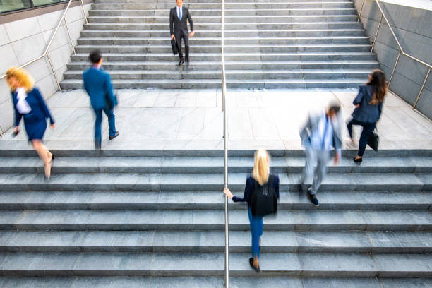 istock Business people walking on stairs 1125707297