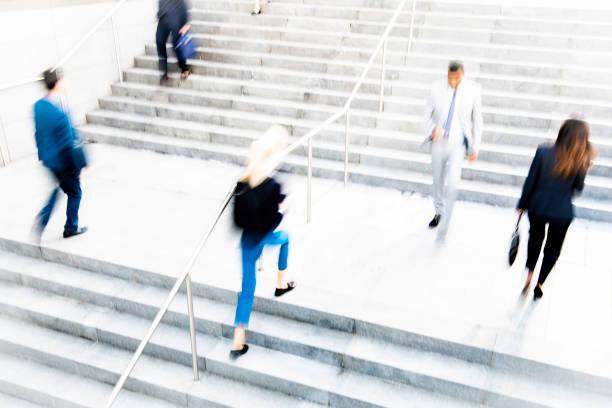 istock Business people walking on stairs 1125707334