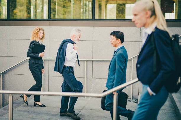 istock Business people walking on stairs 1125707341