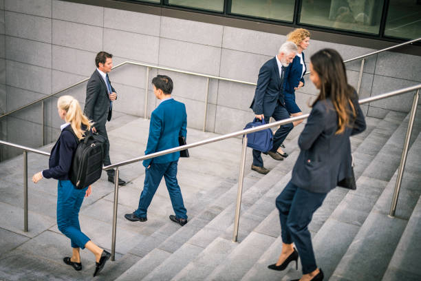 istock Business people walking on stairs 1125707350