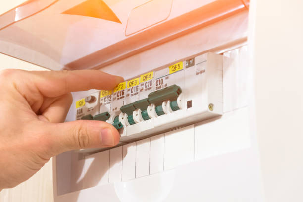 istock Protection of electrical installation setting the switchboard, switch on by hand. 1125707920