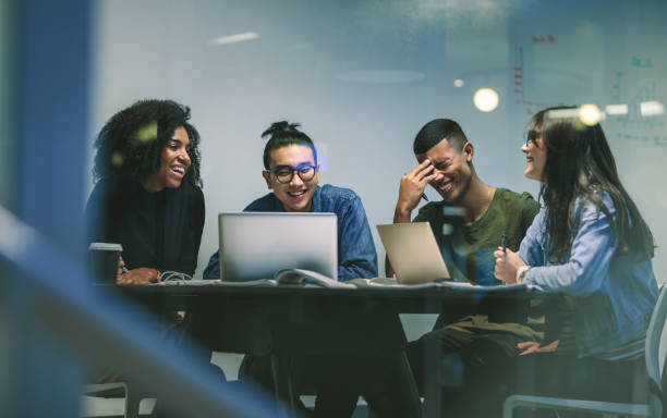 istock Group of happy students in university library 1125707963