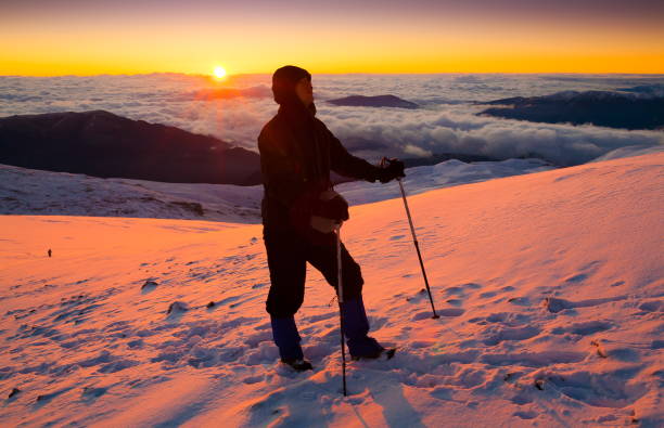 istock A man in mountain sunset winter. Unique. Christmas 1125709992