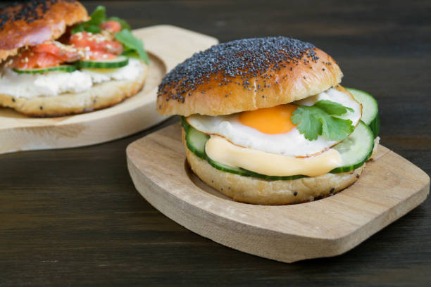 istock egg and cucumber sandwich on wooden background. 1125710731