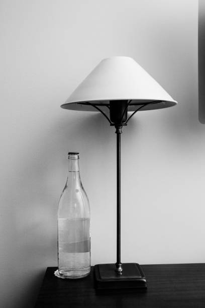 istock Modern lamp and bottle of water. 1125712183