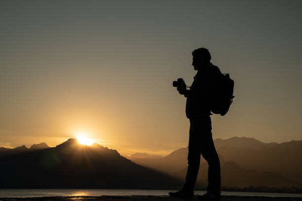 istock Silhouette Of Photographer In Sunset 1125712249