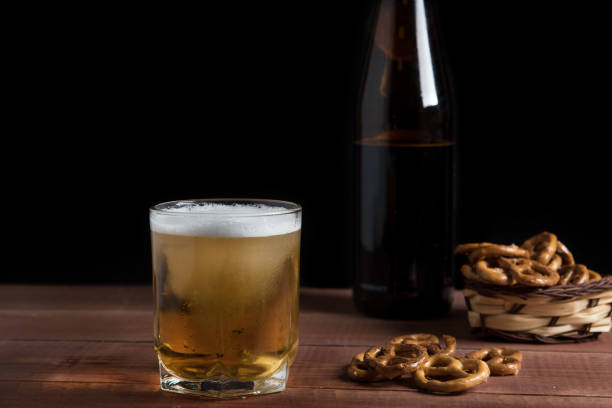 istock light beer in a glass on a wooden table 1125712648