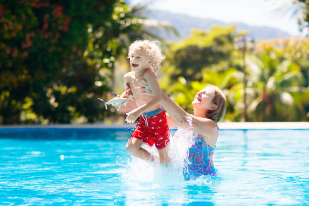 istock Mother and baby in swimming pool 1125714953