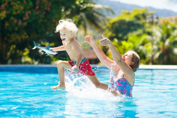 istock Mother and baby in swimming pool 1125715043