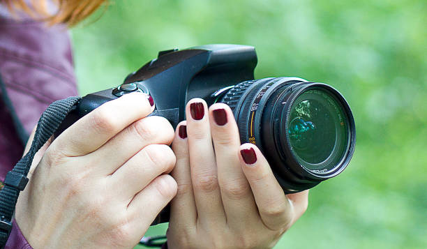 istock Woman photographer with camera 1125715769