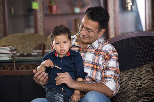 istock Father with little son holding car key 1125715953