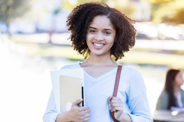 istock Beautiful female college student 1125718855