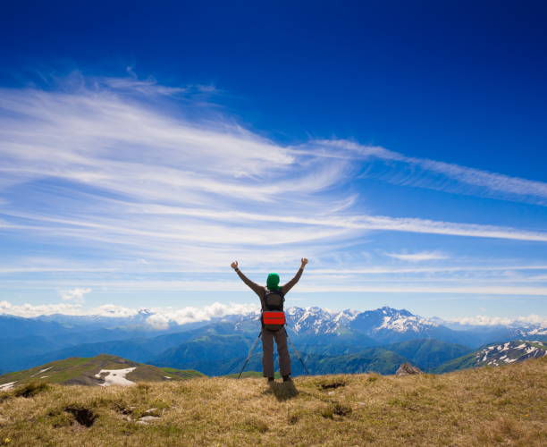 istock A man in mountain day summer. Blue sky. 1125718989